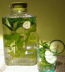Cucumber water with sprigs of lemon balm and peppermint.