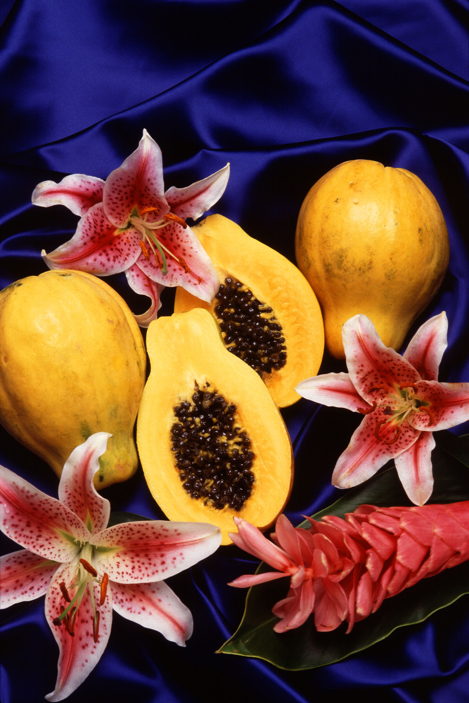 Papayas contain the enzyme papain, which helps loosen the bonds between dead skin cells, thereby exfoliating the skin and reducing the appearance of fine lines, wrinkles, and large pores when used topically in spa and beauty treatments. Photo by Scott Bauer, USDA ARS [Public domain], via Wikimedia 