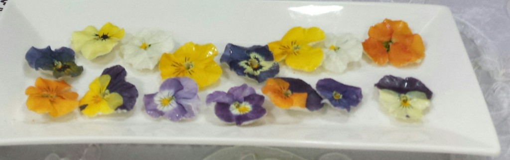 These assorted edible pansies are sold by Fresh Origins, too, and available to chefs and bakers.